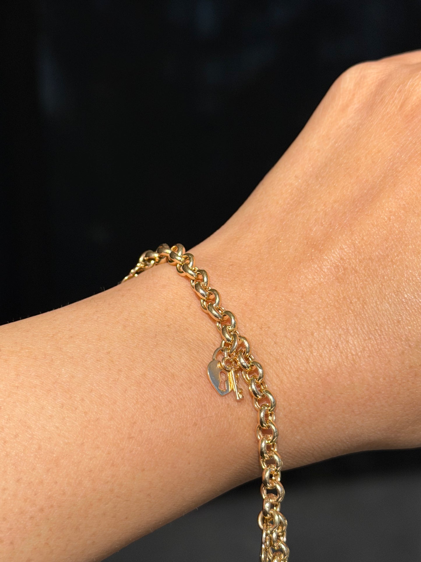 14k rolo bracelet with heart padlocks