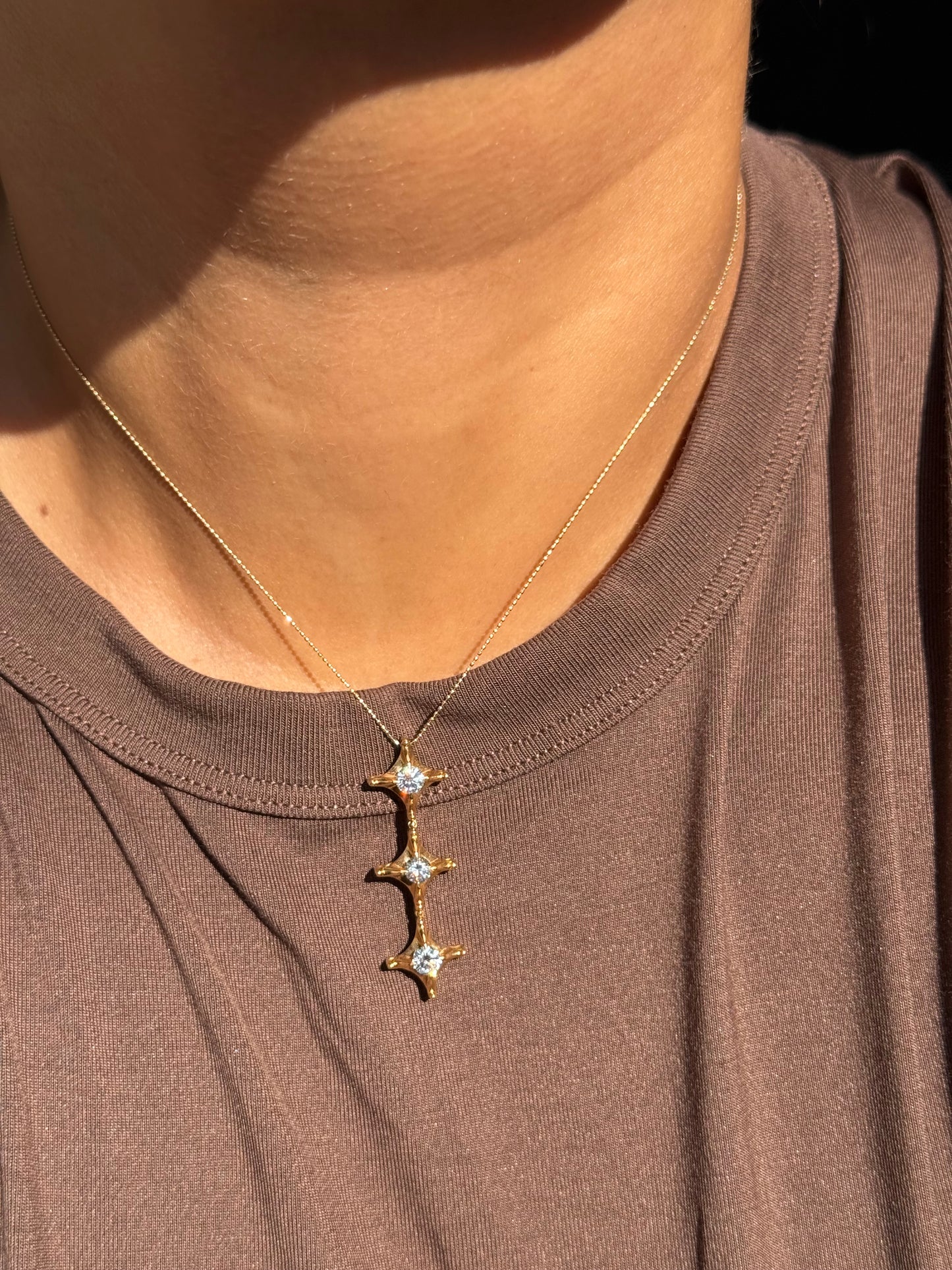 18k Articulated diamond charm + chain